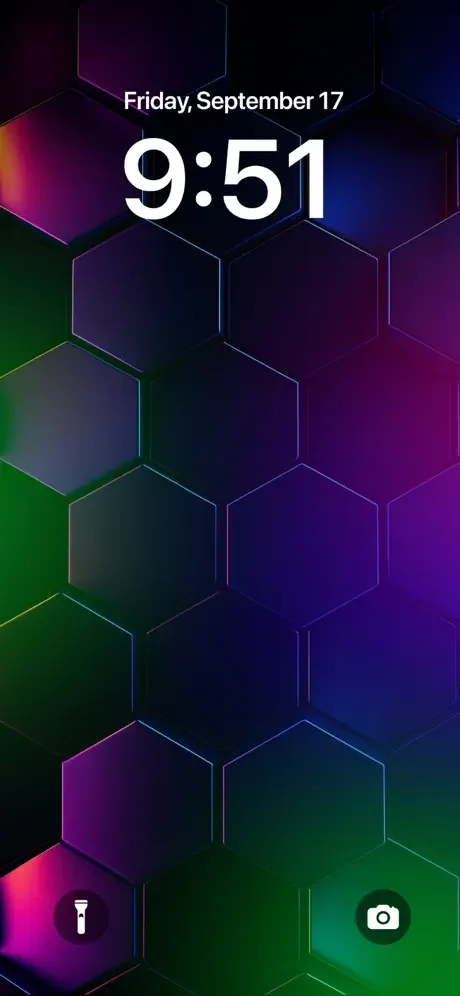 Colorful hexagonal 3D geometric wallpaper with pink, green, and purple gradient effects for iPhone