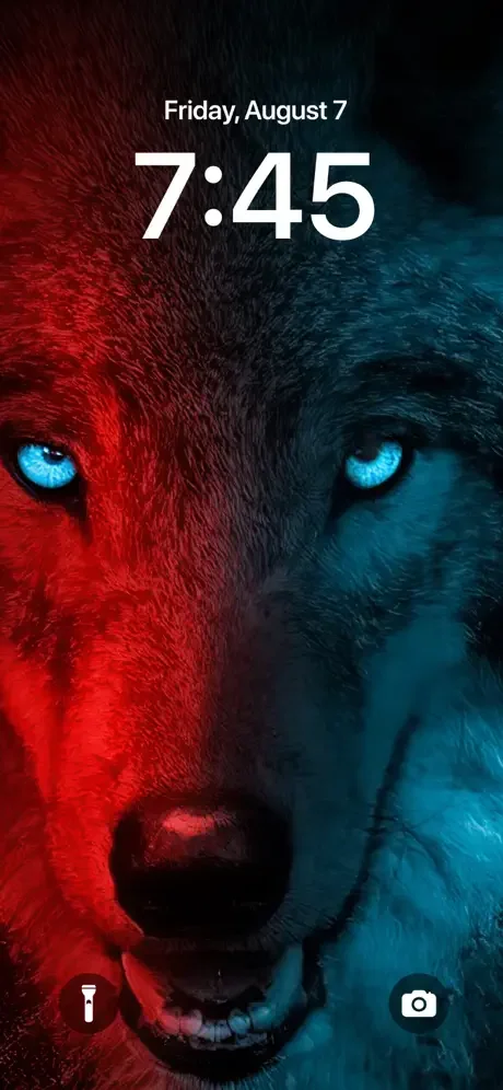 Split-colored wolf face wallpaper with bright blue eyes red and teal colors on lock screen showing Friday August 7 at 7:45